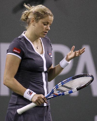 Kim Clijsters of Belgium reacts after losing a point against Alisa Kleybanova of Russia during their match at the Indian Wells WTA tennis tournament in Indian Wells, California, March 15, 2010. (Xinhua/Reuters Photo)