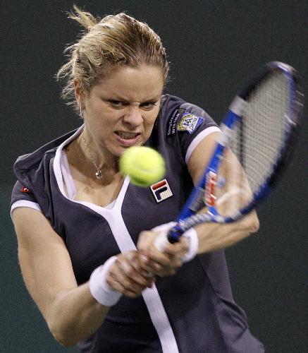 Kim Clijsters of Belgium returns a shot against Alisa Kleybanova of Russia during their match at the Indian Wells WTA tennis tournament in Indian Wells, California, March 15, 2010. Clijsters lost 1-2. (Xinhua/Reuters Photo)