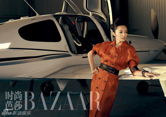 Actress Yao Chen poses by the side of a helicoper for the Harper's Bazaar magazine.