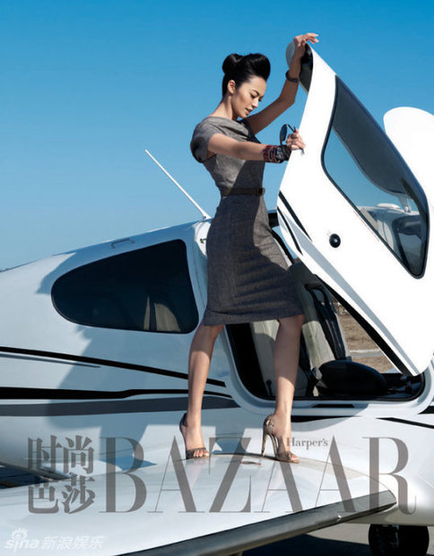 Actress Yao Chen poses by the side of a helicoper for the Harper's Bazaar magazine.