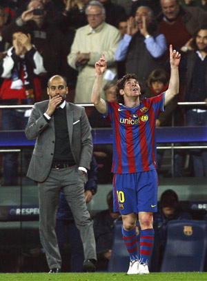 Barcelona's Lionel Messi (R) celebrates in front of his coach Pep Guardiola after scoring a goal against VfB Stuttgart during their Champions League last 16, second leg soccer match at the Nou Camp stadium in Barcelona March 17, 2010. (Xinhua/Reuters Photo)