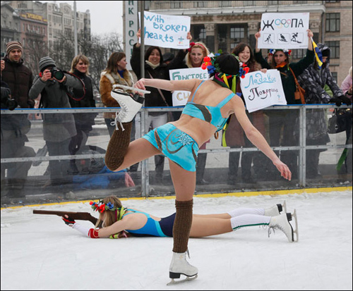 Members of the Ukrainian activist pressure group FEMEN during their action at Independence square in Kiev, Ukraine, Sunday, Feb. 28, 2010, as they make fun of their country&apos;s bad performance in the current Winter Olympics. The human rights group FEMEN parodied the poor performance by Ukrainian sportsmen at the Canada Winter Olympic Games 2010, and are calling for better funding for sports in Ukraine. [CRI]