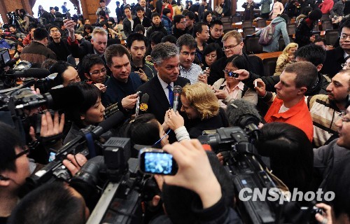 US Ambassador Huntsman is surrounded by reporters at the prestigious Tsinghua University in Beijing on March 18, 2010. 