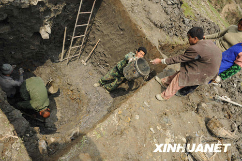 People are digging wells in Xinzhong Village, southwest China's Guizhou Province, on March 17 to seek drinking water for people and livestock amid a prolonged drought.