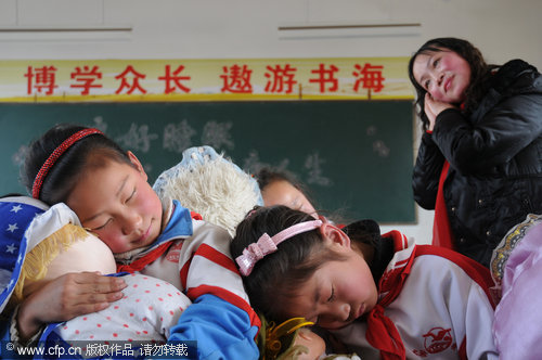 Children practice sleeping during a special 'sleep class' ahead of the World Sleep Day at a primary school in Nanyang city, Henan province. Students were taught different ways to improve their sleep quality. Started by the International Foundation for Mental Health and Neuro-Science in 2001 to raise awareness of sleeping disorders, World Sleep Day falls on March 21 every year.
