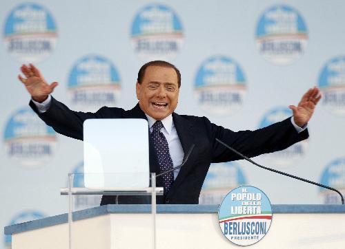 Italy's Prime Minister Silvio Berlusconi gestures as he speaks to supporters of the centre-right Popolo della Liberta (PDL People Freedom Party) during a rally in Rome March 20, 2010.