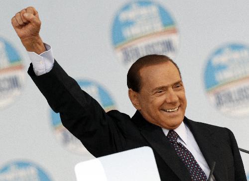 Italy's Prime Minister Silvio Berlusconi gestures as he speaks to supporters of the centre-right Popolo della Liberta (PDL People Freedom Party) during a rally in Rome March 20, 2010. 