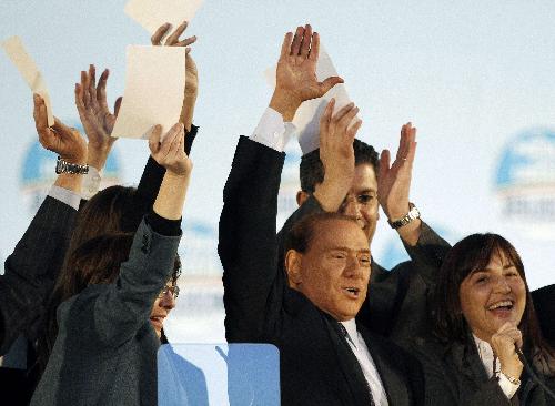 Italy's Prime Minister Silvio Berlusconi gestures as he speaks to supporters of the centre-right Popolo della Liberta (PDL People Freedom Party) during a rally in Rome March 20, 2010.