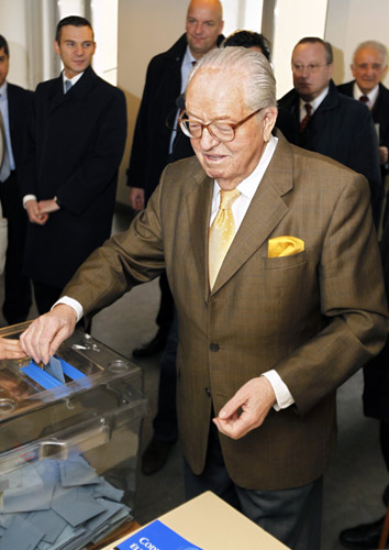 Jean-Marie Le Pen, France far-right political party leader and Alpes-Maritimes region candidate, casts his vote in the second round regional voting in Saint Cloud near Paris March 21, 2010. French regional elections are set to produce a heavy defeat to the centre-right UMP party in its final ballot box test before the 2012 presidential campaign.[Xinhua]