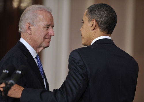 U.S. President Barack Obama (R) gestures to Vice President Joseph Biden after the U.S. House of Representatives passed the comprehensive health care reform legislation at the White House in Washington, capital of the United States, on March 21, 2010. [Zhang Jun/Xinhua]