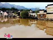 Chengkan village in Huizhou District, Anhui province is famous for the residential architecture of the Ming and Qing style. Baolun Hall in the Ancestral Temple of Luo's, built during the Jiaqing's reign, is a representative collection of typical Huizhou architecture. [Photo by Shi Guangde]