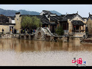 Chengkan village in Huizhou District, Anhui province is famous for the residential architecture of the Ming and Qing style. Baolun Hall in the Ancestral Temple of Luo's, built during the Jiaqing's reign, is a representative collection of typical Huizhou architecture. [Photo by Shi Guangde]