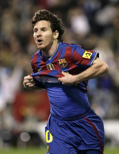 Barcelona's Lionel Messi celebrates his second goal against Zaragoza during their Spanish first division soccer match at La Romadera stadium in Zaragoza. March 21, 2010. (Xinhua/Reuters) 