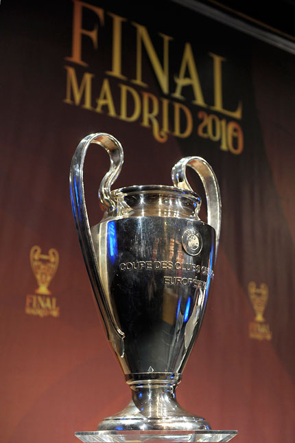The Champions League trophy is photographed before the draw for the quarterfinals at the UEFA headquarters in Nyon, Switzerland, yesterday.