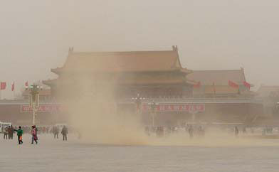 Dust sweeps through Tian'anmen Square in central Beijing on Saturday as North China reeled under a huge sandstorm. [China Daily]
