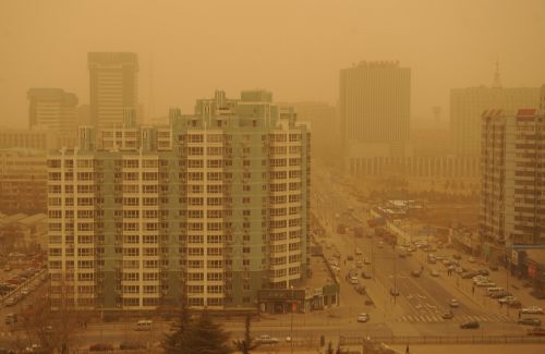 Sandstorm envelops Beijing, capital of China, March 20, 2010. A severe sandstorm that plagued northwestern China in the past few weeks arrived in Beijing Friday night, packing strong winds and tones of sand. [Xinhua]