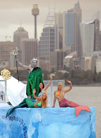 Marine biologists dress up as Mermainds and SeaGod and sit on a ship 'Iceberg' to mark World Water Day March 22, 2010, in Australia. This is the 18th World Water Day. UN-Water has chosen ''Clean Water for a Healthy World' as theme for World Water Day 2010. [Xinhua/AFP]