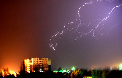 Photo taken early March 21, 2010 shows a thunder flash lighting up the sky over Luoping County, southwest China's Yunnan Province.