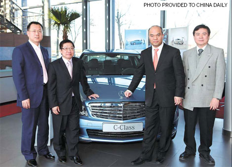 Li Hongpeng (left), GM for sales and marketing of Sino-German car JV Beijing Benz, Don Chan (2nd from left), director and general manager of Fortis Lease (China) Co Ltd for Greater China, and Patrick Chou (third from left), chairman of car dealership Beijing BetterLife Group with a Mercedes-Benz C-Class in a Beijing showroom. 