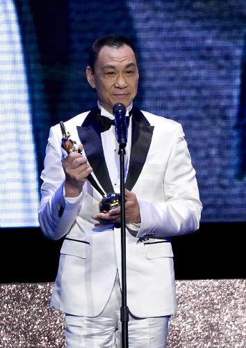 Actor Wang Xueqi addresses the awarding ceremony after winning the Best Actor award at the Asian Film Awards in Hong Kong, south China, on March 22, 2010. 