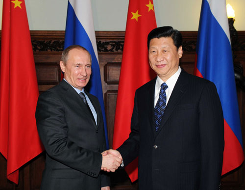 Chinese Vice President Xi Jinping (R) meets with Russian Prime Minister Vladimir Putin in Moscow, capital of Russia, March 23, 2010. [Rao Aimin/Xinhua] 