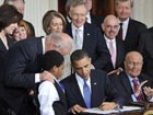 Obama signs landmark healthcare bill