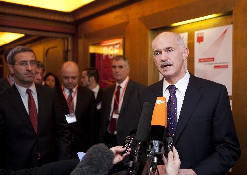 Greek Prime Minister George Papandreou speaks to media upon his arrival to a Sociallist Party Group (PSE) meeting prior to the European summit in Brussels, capital of Belgium, March 25, 2010. Papandreou on Thursday urged European Union leaders to stabilize the euro while the cash-strapped country determines to continue a program to cut its ballooning budget deficit. [Xinhua]