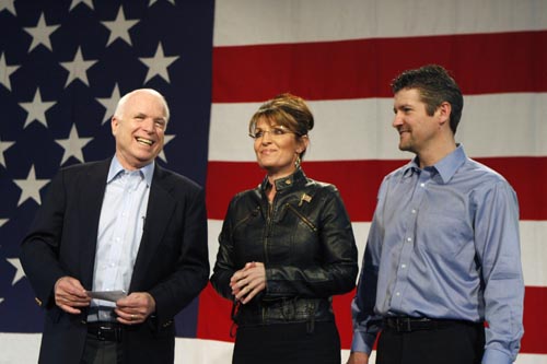 U.S. Senator John McCain (L)(R-AZ), former Alaska governor and vice presidential candidate Sarah Palin (C) and her husband Todd Palin attend a campaign rally for McCain at the Pima County Fairgrounds in Tucson, Arizona March 26, 2010.