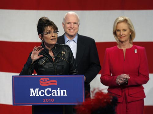 Former Alaska Governor and Vice Presidential candidate Sarah Palin (L) speaks as U.S. Senator John McCain (C)(R-AZ) and his wife Cindy McCain listen during a campaign rally for McCain at the Pima County Fairgrounds in Tucson, Arizona March 26, 2010.