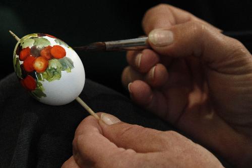 The photo taken on March 26 shows that an artist draws an Easters Egg at an Easter trade fair, which is held in a Museum in Hamburg, Germany.