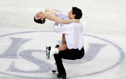 Canada's Tessa Virtue (L) and Scott Moir perform during the ice dance free dance event at the ISU World Figure Skating Championships in Turin, Italy, March 26, 2010. Virtue/Moir claimed the title with 224.43 points. 