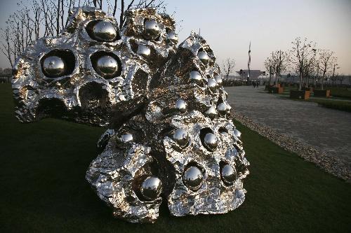 Photo taken on March 26, 2010 shows a sculpture in the shape of lotus seedpod at the Expo Park in Shanghai, east China. The Expo Park will be put into trial operation in the end of April.