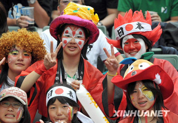 Fans pose for photos at the Hong Kong Sevens rugby event, March 27, 2010.