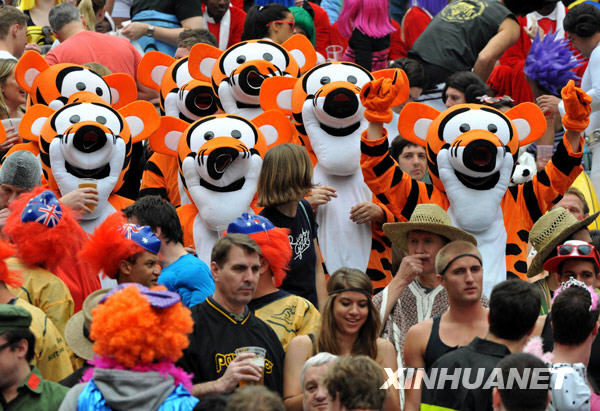 Fans pose for photos at the Hong Kong Sevens rugby event, March 27, 2010.