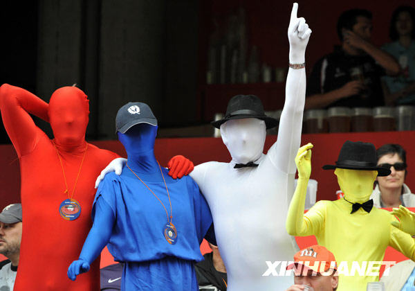 Fans pose for photos at the Hong Kong Sevens rugby event, March 27, 2010.