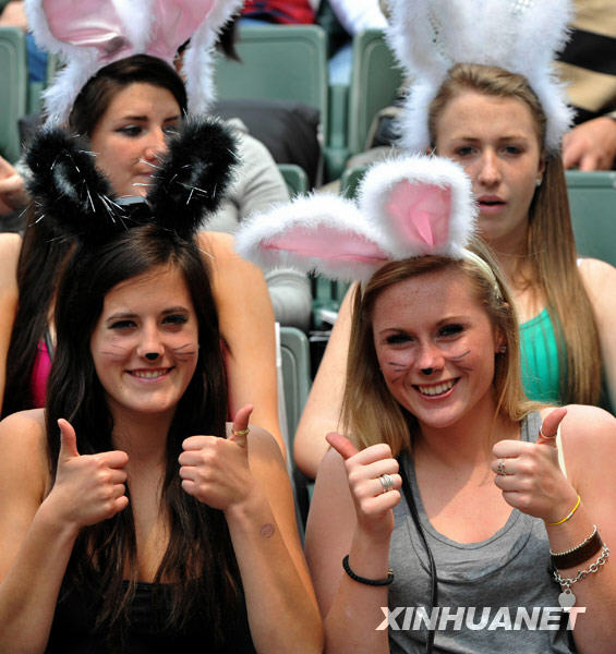 Fans pose for photos at the Hong Kong Sevens rugby event, March 27, 2010.