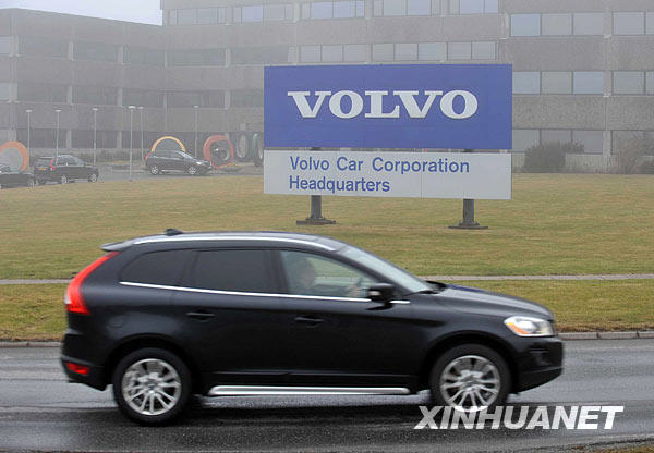 A Volvo SUV passes the headquarters of Volvo on March 27, 2010. China's Zhejiang Geely Holding Group on March 28 signs a deal with Ford Motor Co. on the takeover of Sweden's Volvo Cars. [Xinhua]