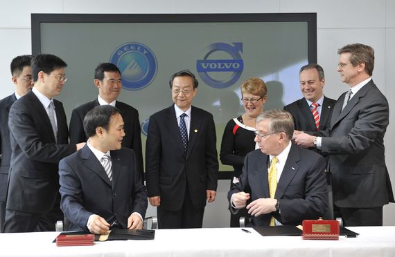Geely's Chairman Li Shufu (L2) signs the deal with Ford's CFO Lewis Booth. China's Zhejiang Geely Holding Group on March 28 signs a deal with Ford Motor Co. on the takeover of Sweden's Volvo Cars.