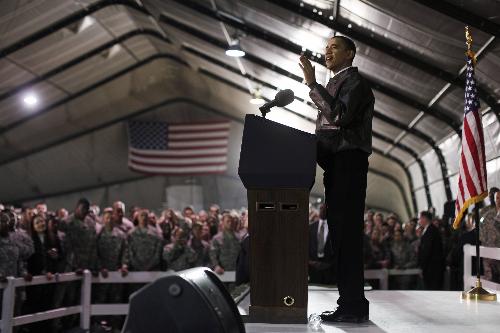 U.S. President Barack Obama meets with troops at Bagram Air Base in Kabul, March 28, 2010. Obama arrived unannounced in Afghanistan on Sunday, his first visit to the war zone that could define his presidency since his election as U.S. commander-in-chief. Air Force One landed in darkness at Bagram airfield north of the Afghan capital, and Obama was whisked by helicopter to Hamid Karzai&apos;s palace in Kabul, where he was greeted by the Afghan president and a band playing the U.S. national anthem. [Xinhua]