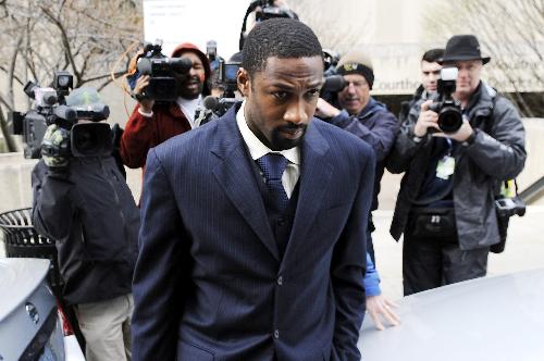 Gilbert Arenas, All-Star guard for the NBA's Washington Wizards, departs after being sentenced to two years' probation on firearms charges for bringing guns into the team's locker room, at Superior Court in Washington, March 26, 2010. Arenas and team mate Javaris Crittenton brought guns to the team's arena after a dispute during a flight home from a game in December. (Xinhua/Reuters Photo)