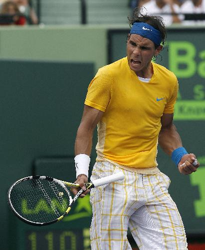 Spain's Rafael Nadal celebrates winning a point against Argentina's David Nalbandian during their match at the Sony Ericsson Open tennis tournament in Key Biscayne, Florida, March 28, 2010. (Xinhua/Reuters Photo)