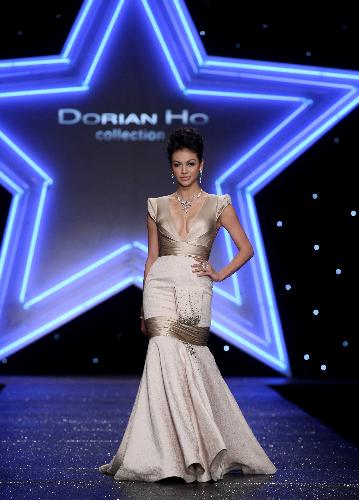 A model presents a creation designed by Dorian Ho in Beijing, China, March 28, 2010.