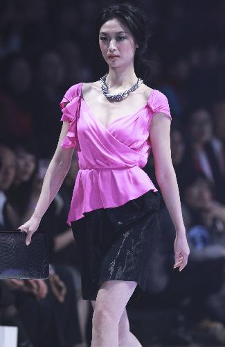 A model presents a design of MARISFROLG in Beijing, China, March 28, 2010.