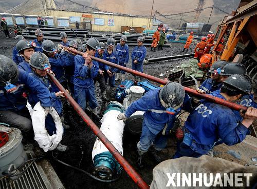 Rescuers work at the site of a flooding accident of Wangjialing Coal Mine, sitting astride Xiangning county of Linfen city and Hejin city of Yuncheng city, in north China's Shanxi province, on March 29, 2010.[Xinhua]