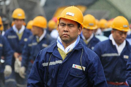 Rescuers work at the site of a flooding accident of Wangjialing Coal Mine, sitting astride Xiangning County of Linfen City and Hejin City of Yuncheng City, in north China's Shanxi Province, on March 29, 2010. (Xinhua