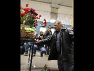 A man places flowers in memory of the bomb victims at the Cultural Park subway station in Moscow, capital of Russia, March 29, 2010. Two suicide bombers exploded themselves in two subway stations in Moscow during rush hours on Monday morning, killing at least 38 people and injuring more than 64 others. The first took place at 7:52 a.m. local time (0352 GMT) at the Lubyanka station and the second bomb detonated some 40 minutes later at the nearby Cultural Park station. [Xinhua] 