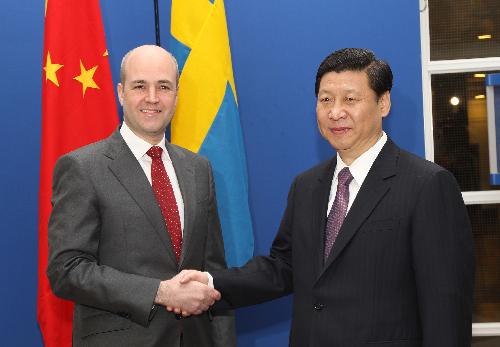 Chinese Vice President Xi Jinping (R) meets with Swedish Prime Minister Fredrik Reinfeldt in Stockholm, Sweden, March 29, 2010. [Lan Hongguang/Xinhua]