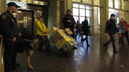Police officers of the New York Police Department (NYPD) stand guard at the Grand Central Station in New York, the United States, March 29, 2010. New York City stepped up security as a precaution Monday following the suicide bombings in Moscow's subway system, sending more police into rail and subway stations. [Xinhua]