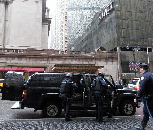 Police officers of the New York Police Department (NYPD) stand guard outside the Grand Central Station in New York, the United States, March 29, 2010. New York City stepped up security as a precaution Monday following the suicide bombings in Moscow's subway system, sending more police into rail and subway stations.[Xinhua] 