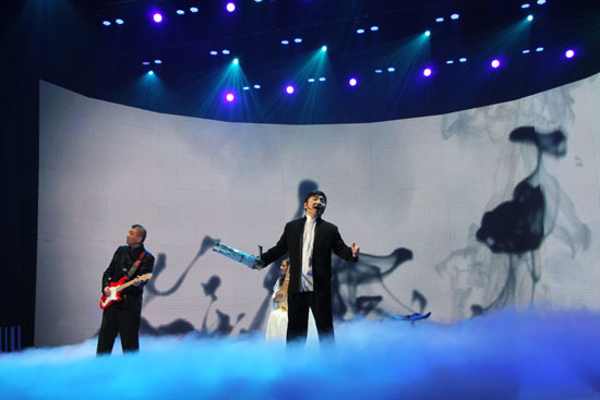 Artists perform at the 6th China National Garment Association Awards at the Century Theater in Beijing on March 28, 2010. 